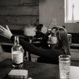 a lady behind the lens